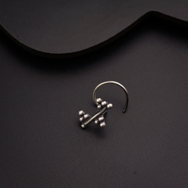 a pair of earrings sitting on top of a table