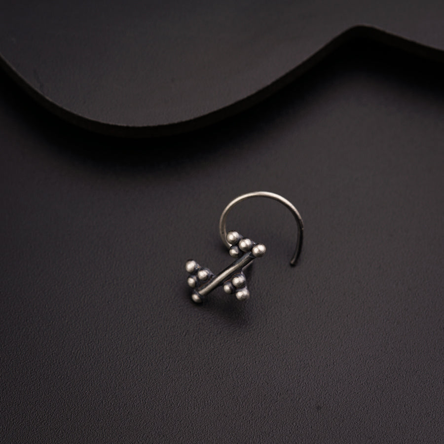 a pair of earrings sitting on top of a table
