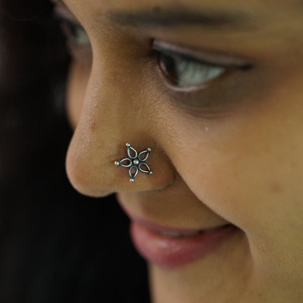 a close up of a person with a nose piercing