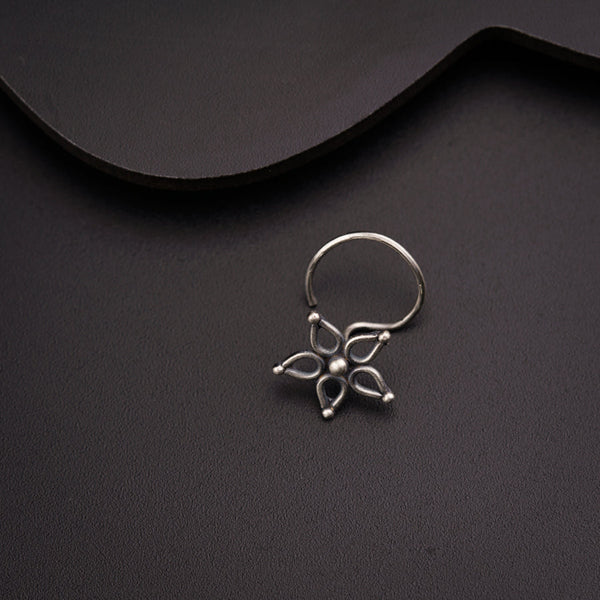 a close up of a ring on a black surface