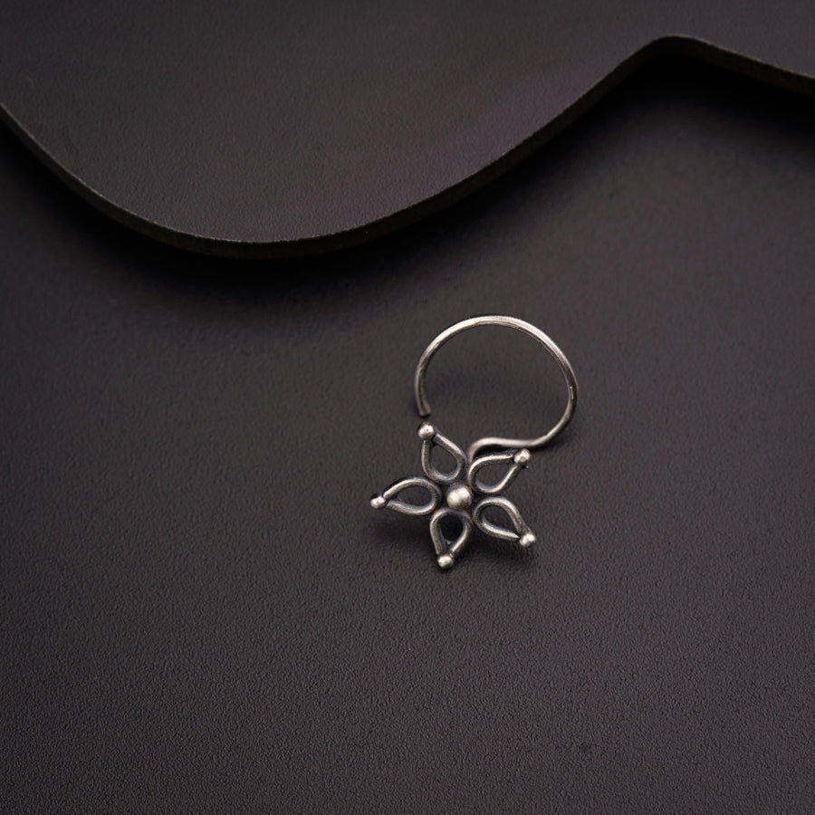 a close up of a ring on a black surface