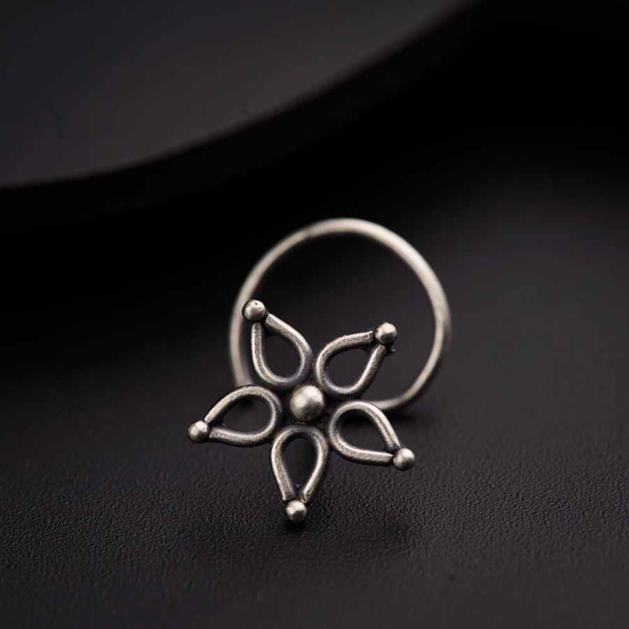 a close up of a ring on a black surface