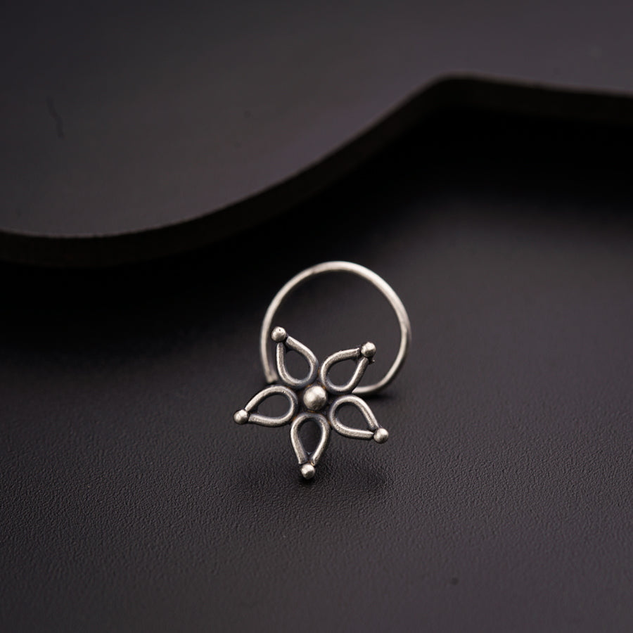 a close up of a ring on a black surface