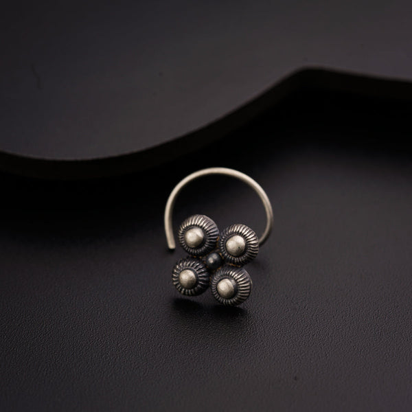 a close up of a ring on a black surface