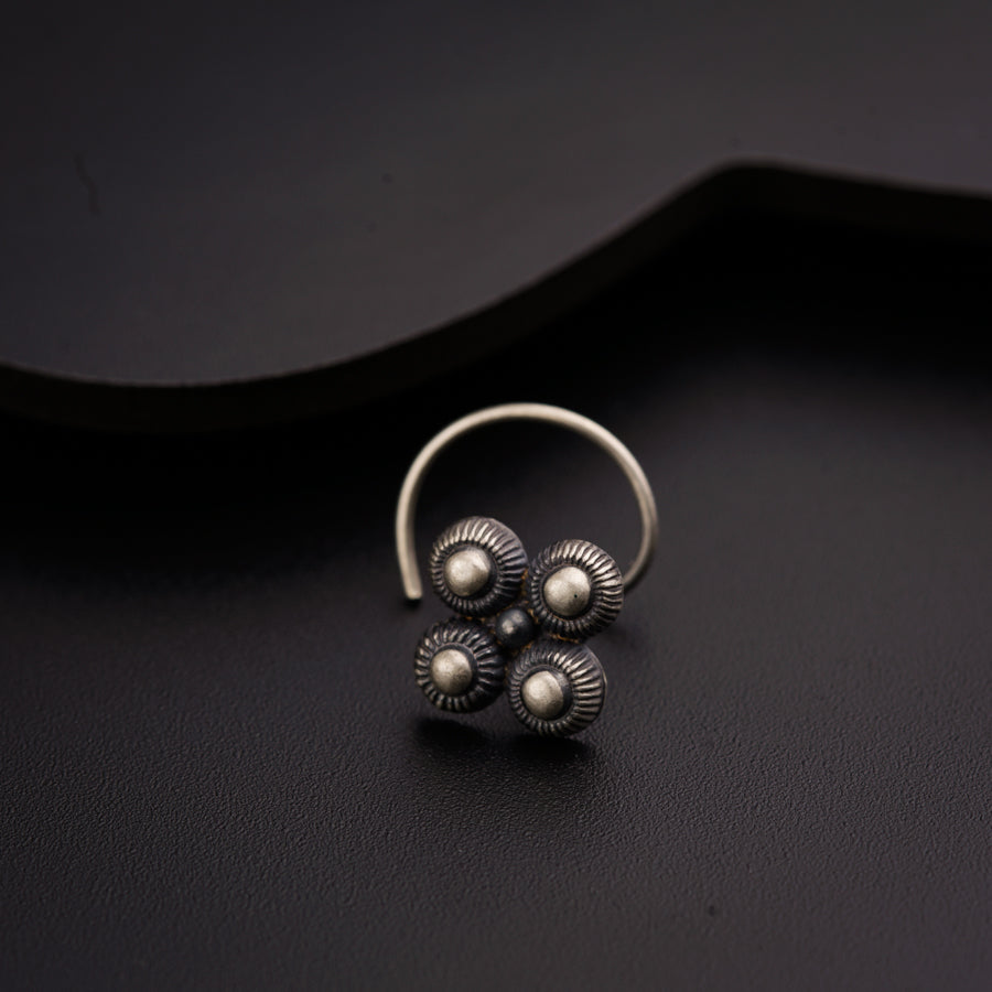 a close up of a ring on a black surface