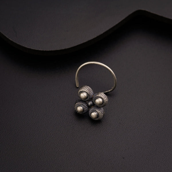 a close up of a ring on a black surface