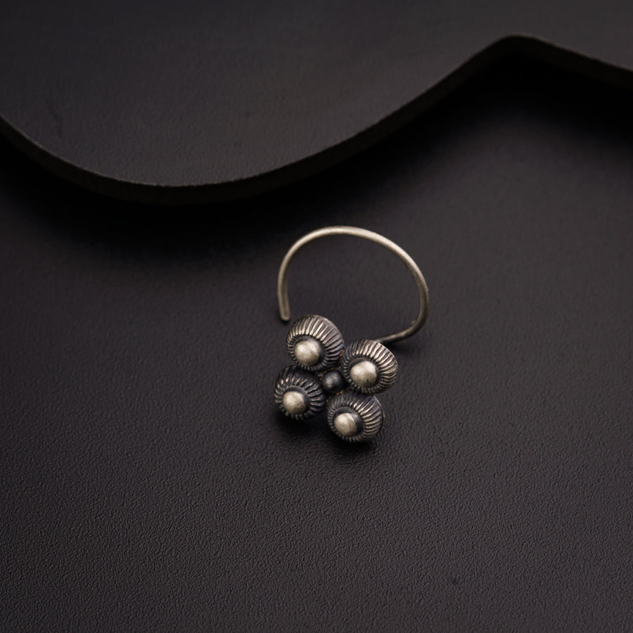 a close up of a ring on a black surface