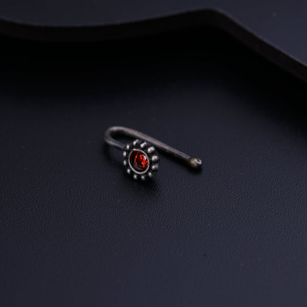 a close up of a ring on a black surface
