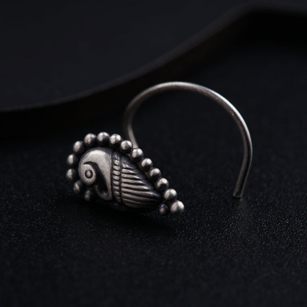 a close up of a ring on a black surface