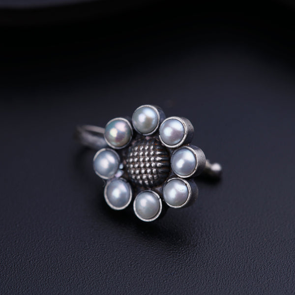 a close up of a ring on a black surface