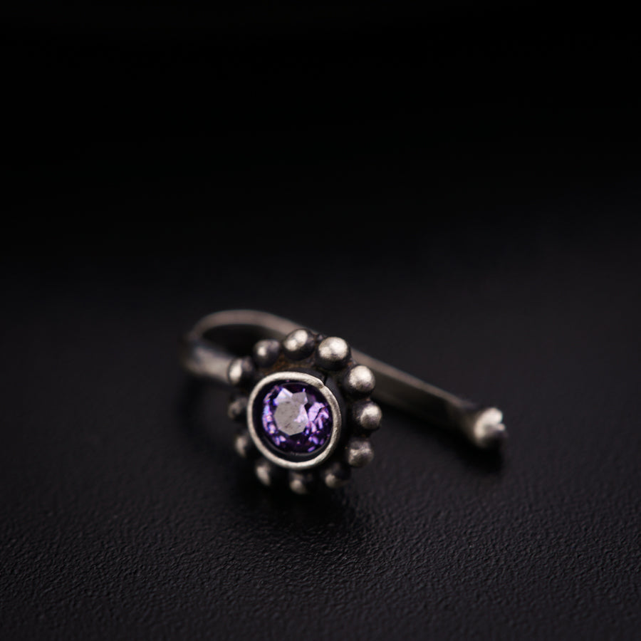 a close up of a ring on a black surface