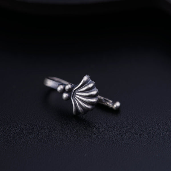 a close up of a ring on a black surface