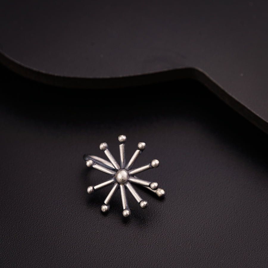 a black and white photo of a brooch