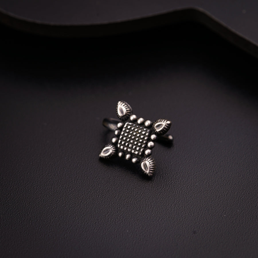 a close up of a ring on a black surface