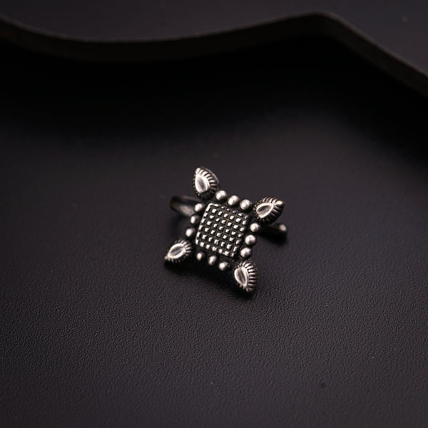 a close up of a ring on a black surface