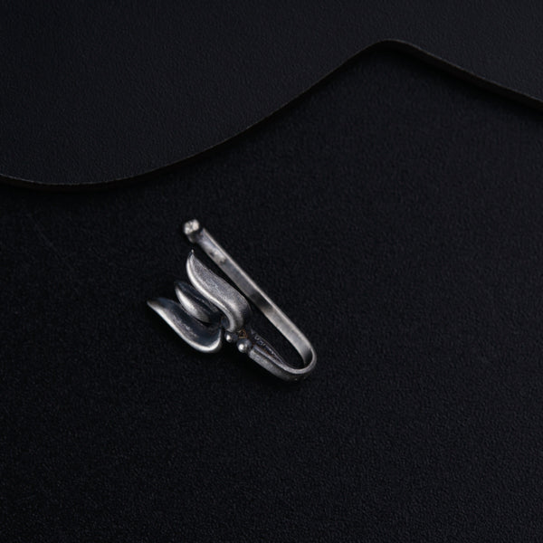 a pair of scissors sitting on top of a black surface