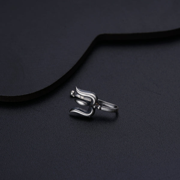 a close up of a metal object on a black surface