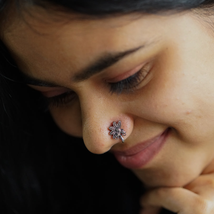 a close up of a person with a nose piercing