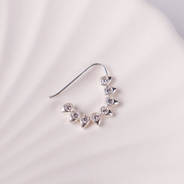 Close-up of CZ petal nath big pierced silver earring