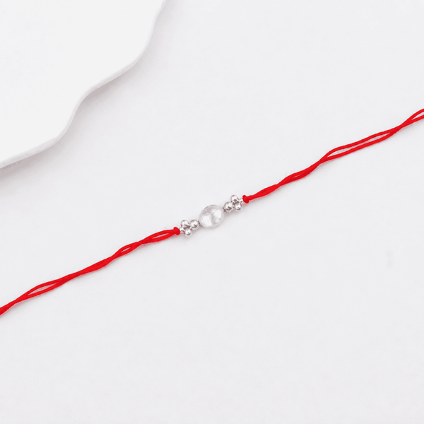 Elegant baroque pearl Rakhi with silver beads for brother