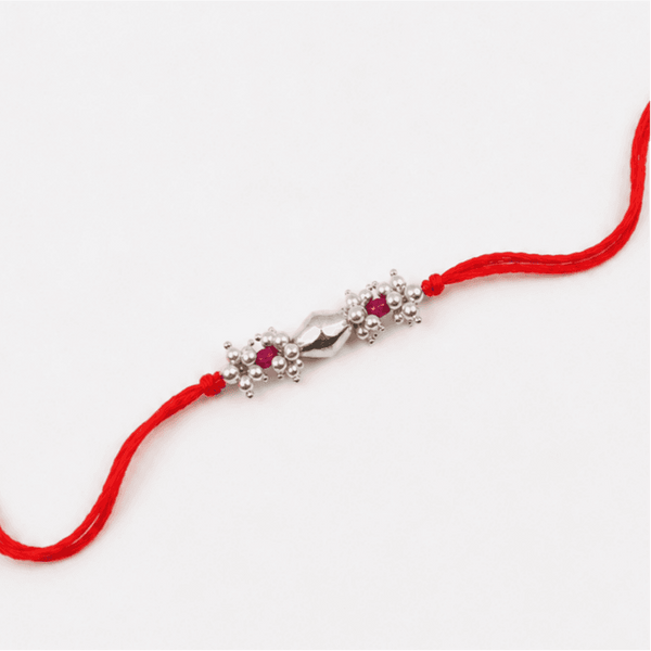Close-up of Silver Dholki Bead Ruby & Pearl Bunch Rakhi craftsmanship