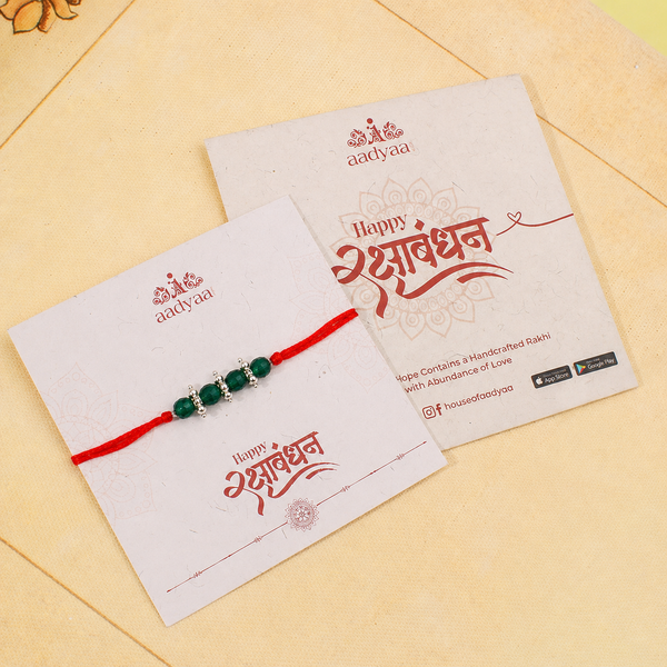 Elegant green onyx and pearl gemstone Rakhi for brother