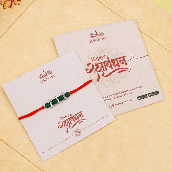 Elegant green onyx and pearl gemstone Rakhi for brother