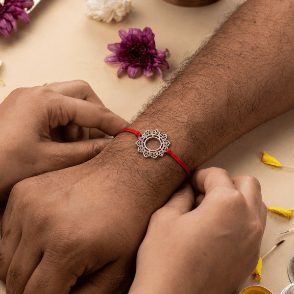 Big Filigree Silver Rakhi tied on the wrist, celebrating the bond of Raksha Bandhan with timeless elegance
