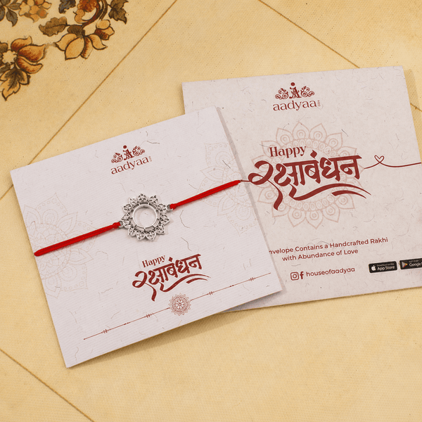 Big Filigree Silver Rakhi styled with festive attire and traditional accessories for Raksha Bandhan celebrations