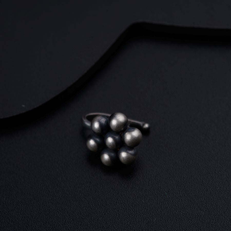 a bunch of balls sitting on top of a black surface