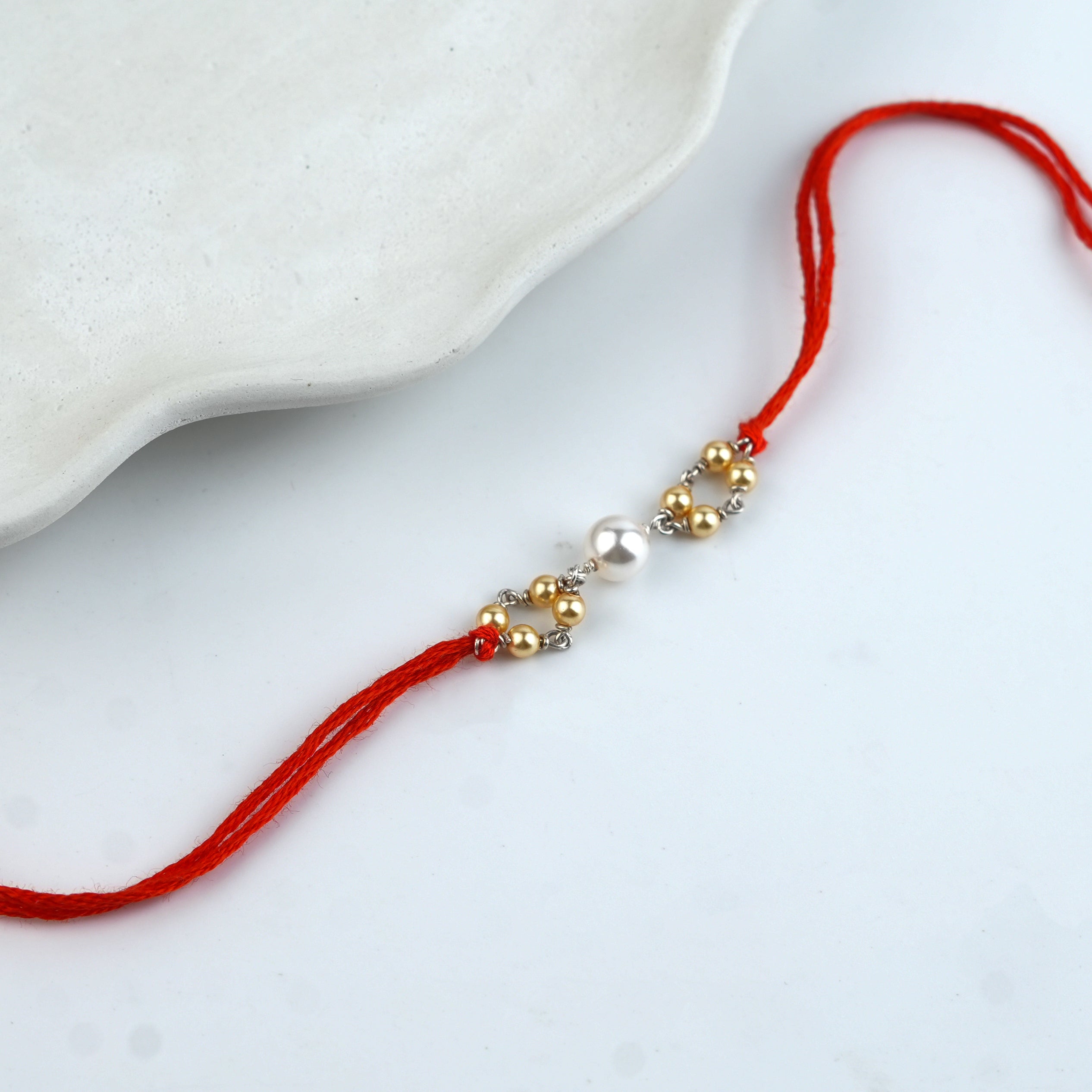 Golden & White Pearl Handmade Silver Rakhi