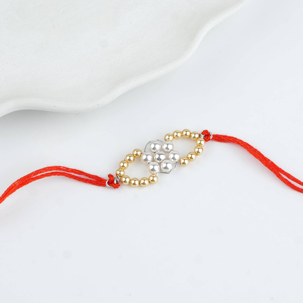 Golden & White Pearl Handmade Silver Rakhi
