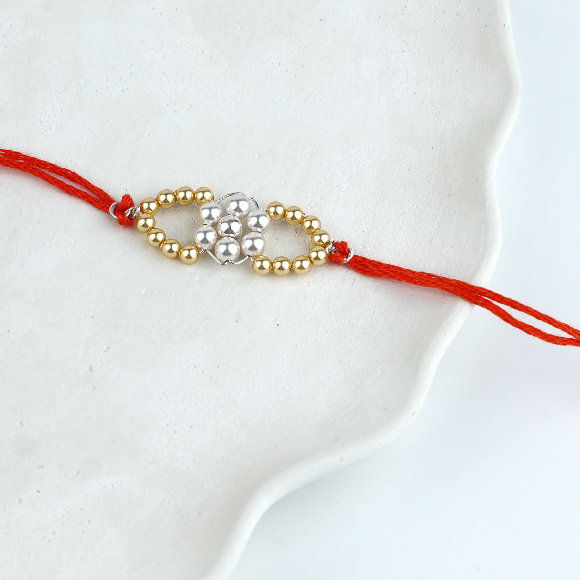 Golden & White Pearl Handmade Silver Rakhi