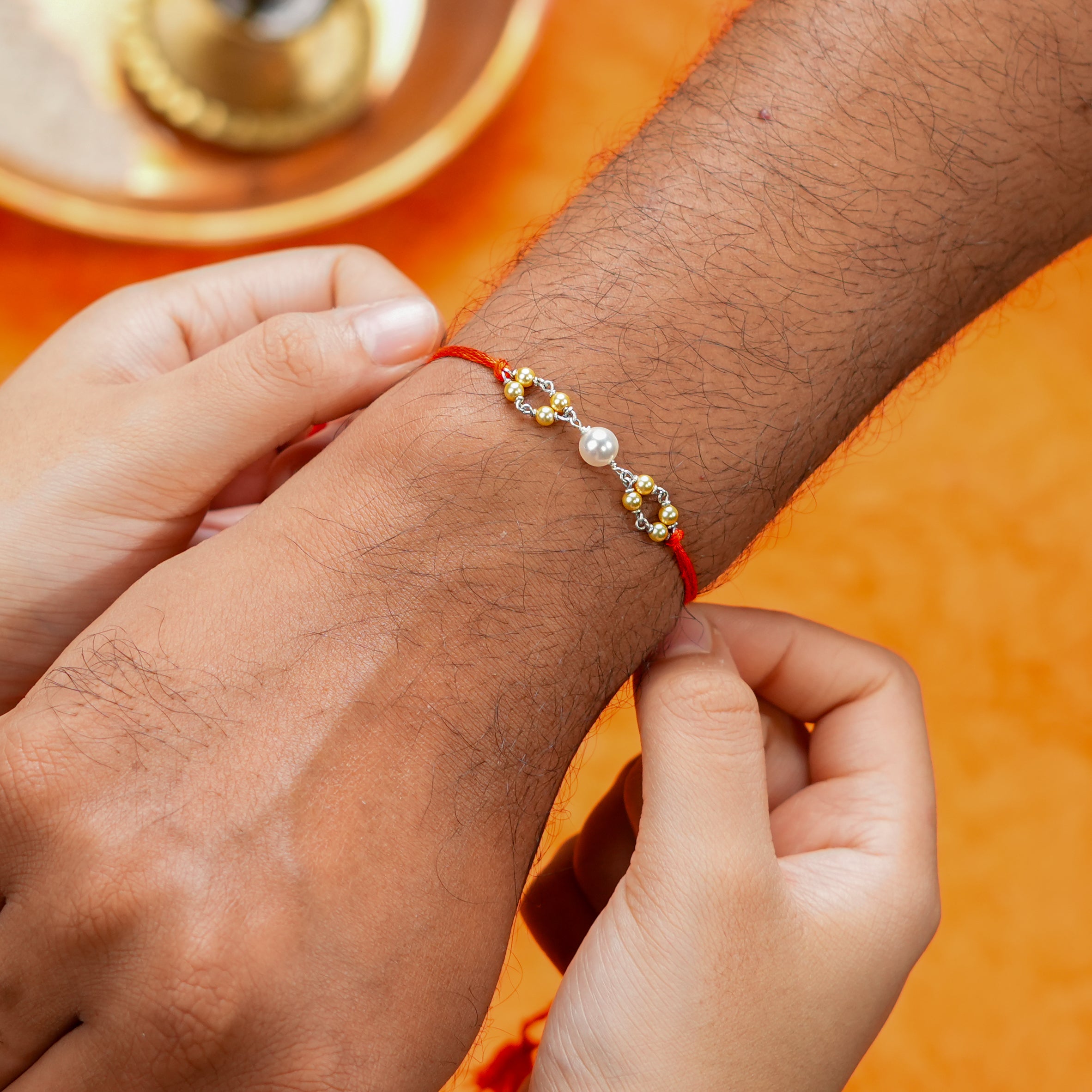Golden & White Pearl Handmade Silver Rakhi