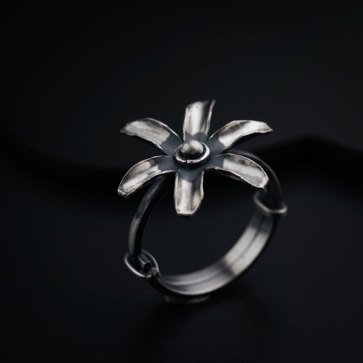a close up of a ring on a black surface