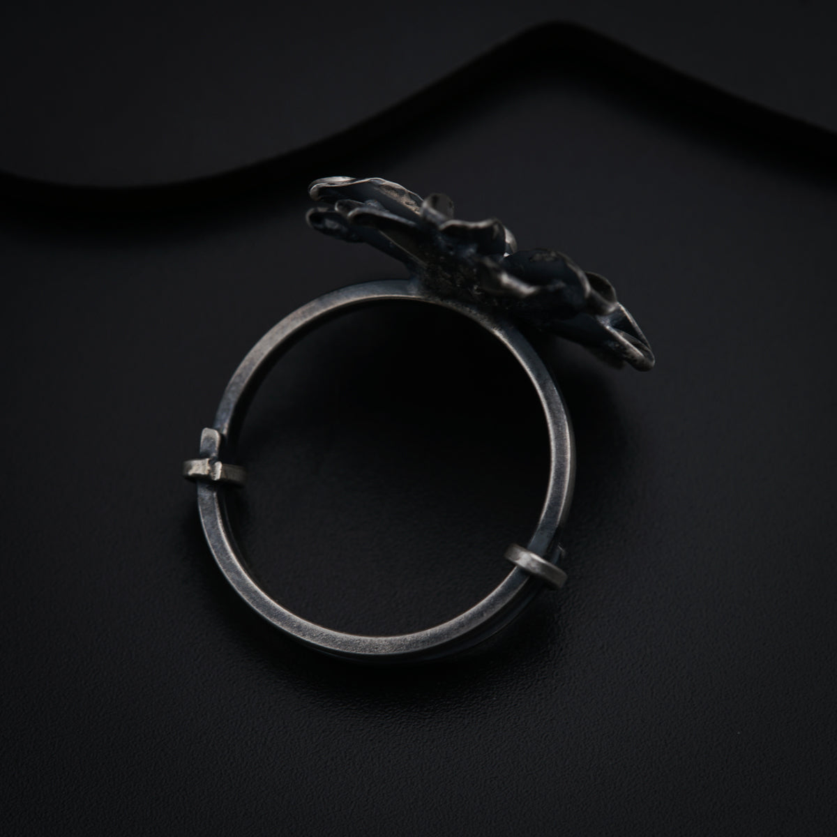 a silver ring with a horse head on it