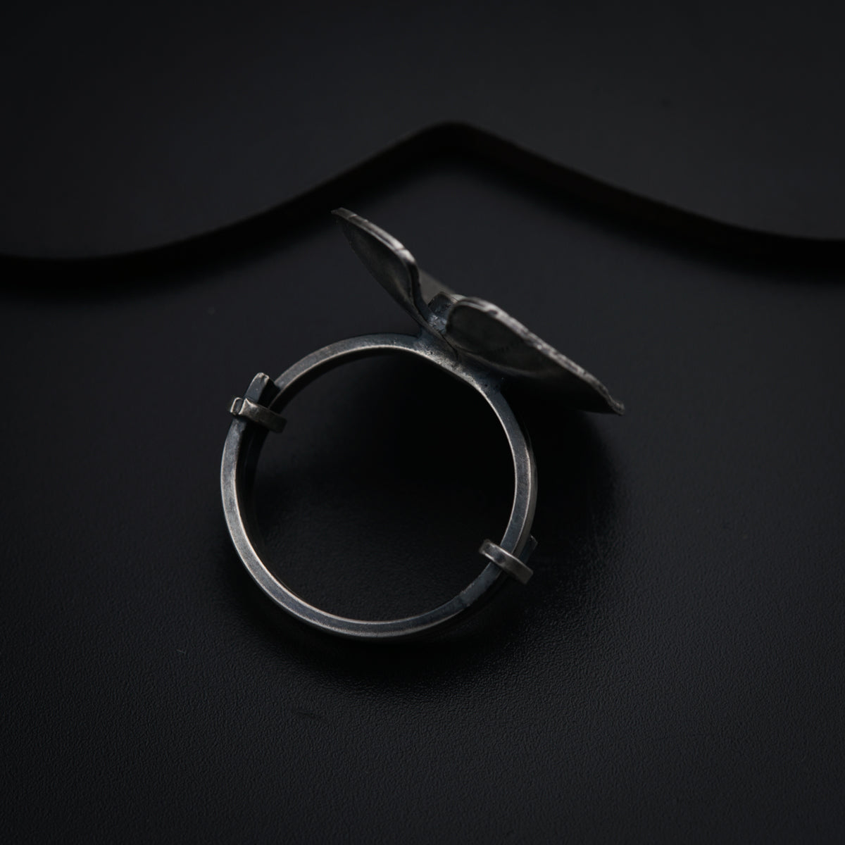 a pair of scissors sitting on top of a black surface