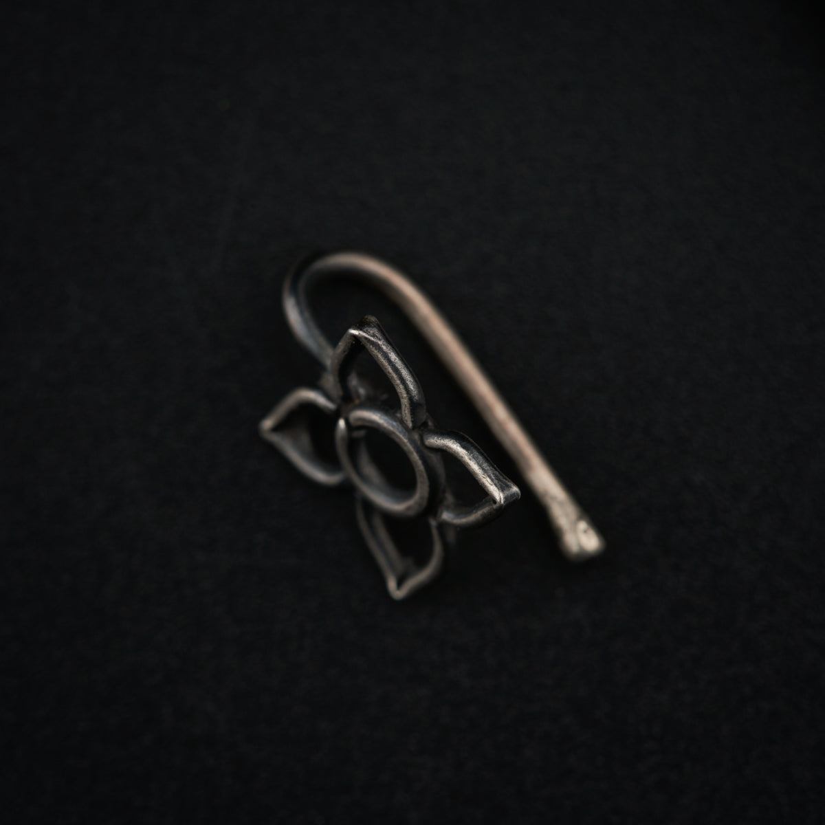 a pair of scissors sitting on top of a black surface