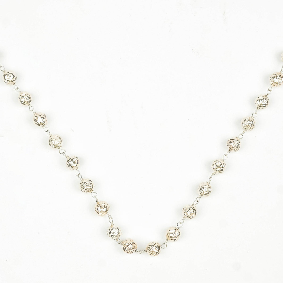 Close-up of Silver Mohanmaal Ganthan Necklace showcasing intricate ganthan work, detailed beads, and fine silver craftsmanship