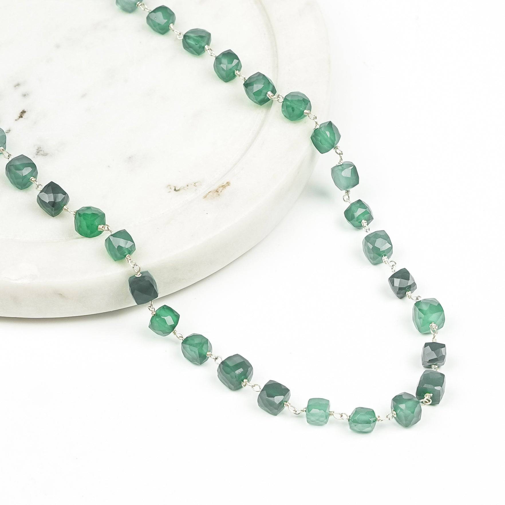 Angled view of Silver Green Onyx Ganthan Necklace highlighting its graceful bead arrangement, layered structure, and elegant traditional design