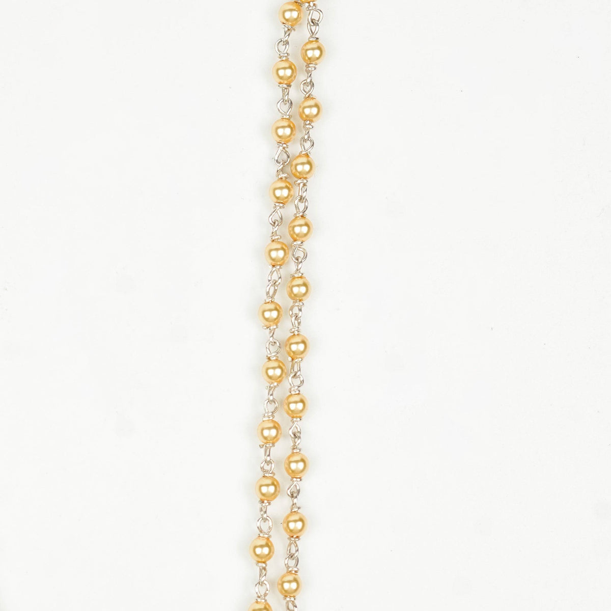 Close-up of Silver Golden Pearl Ganthan Necklace showcasing lustrous golden pearls, intricate ganthan work, and fine silver craftsmanship