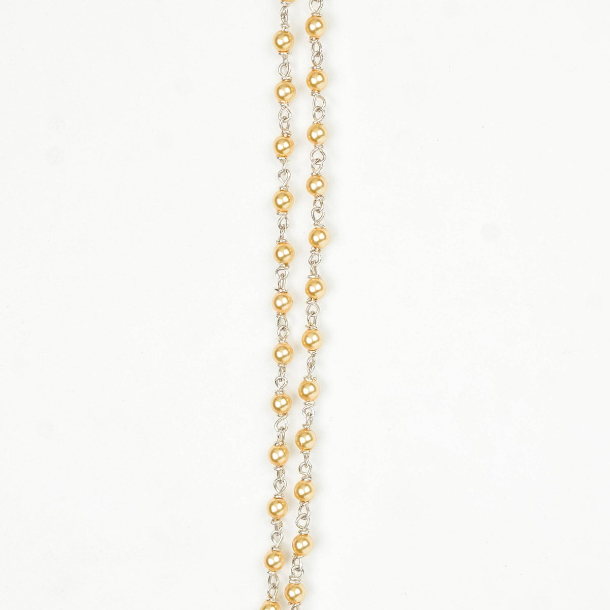 Close-up of Silver Golden Pearl Ganthan Necklace showcasing lustrous golden pearls, intricate ganthan work, and fine silver craftsmanship