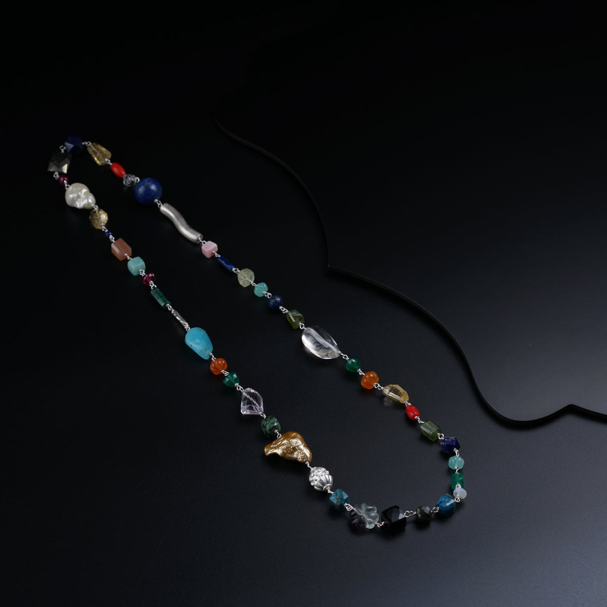 a beaded necklace with various colored beads