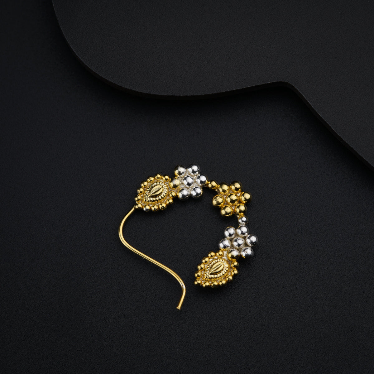 a pair of gold and white beaded earrings
