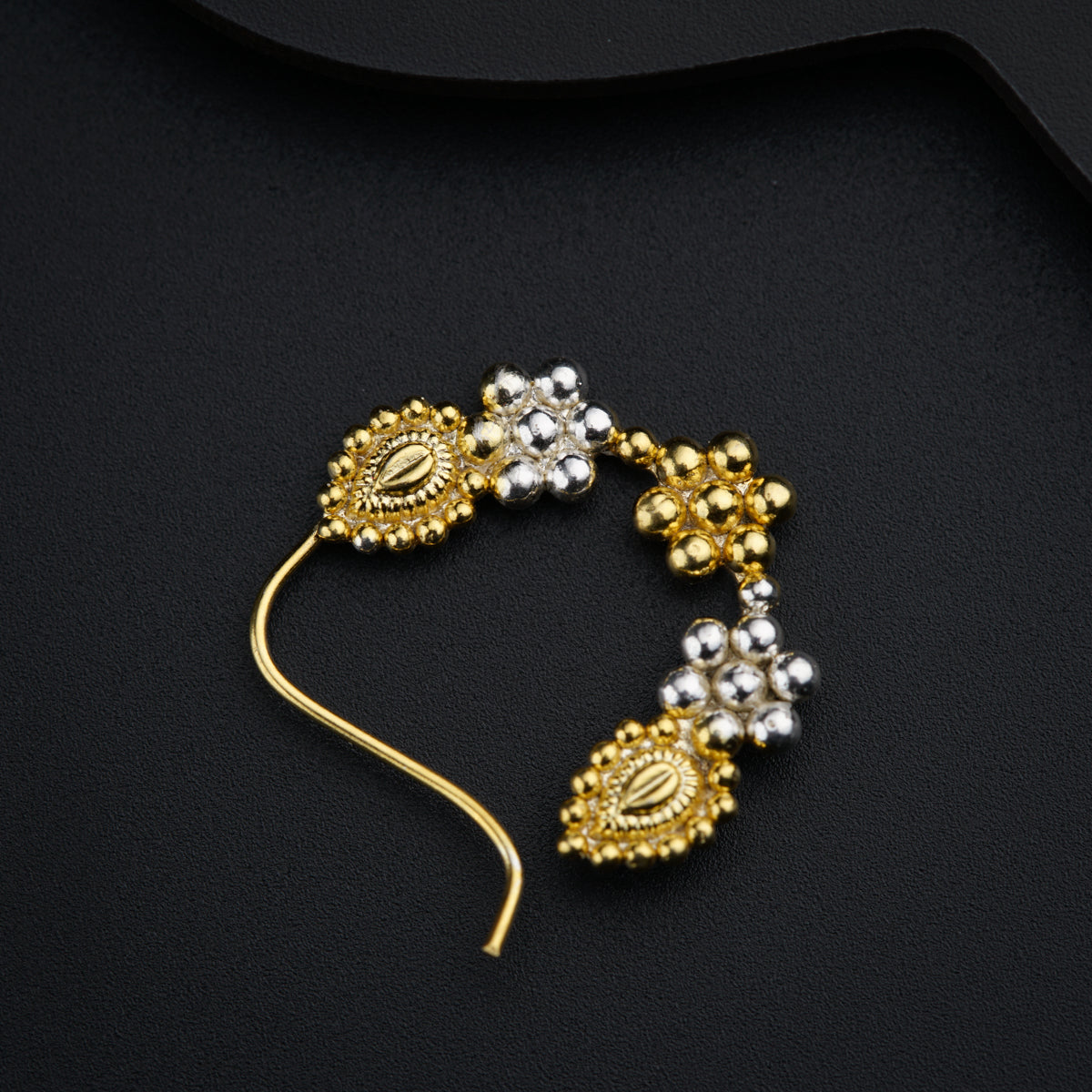 a pair of gold and silver beaded earrings