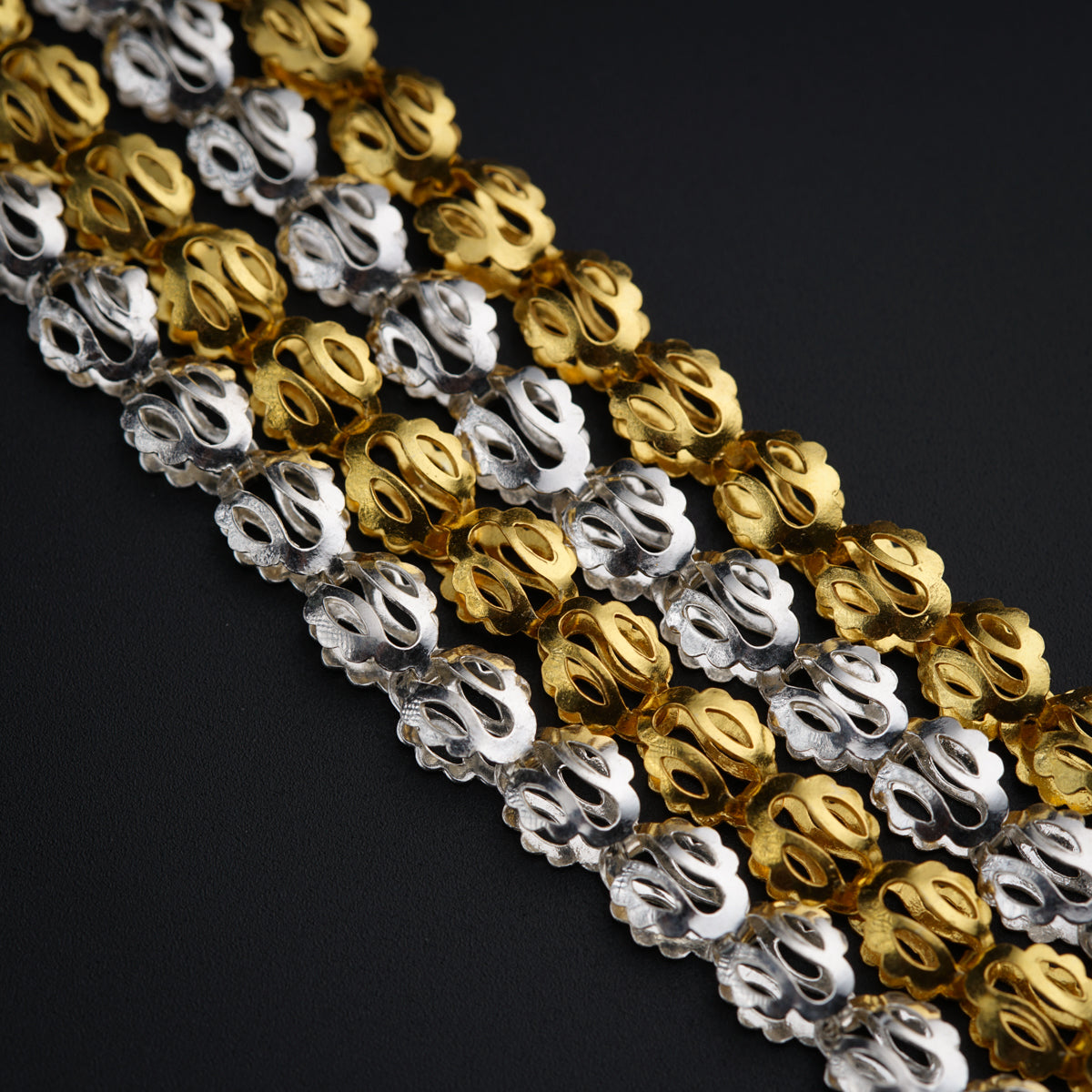 a close up of a gold and silver chain