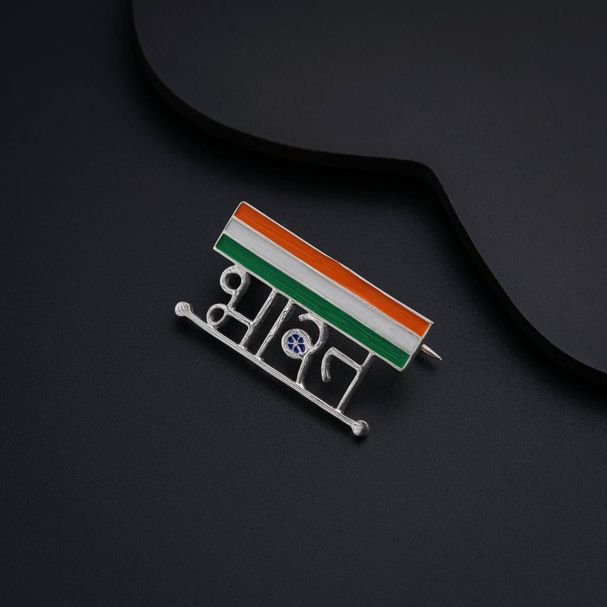 a flag pin sitting on top of a black table