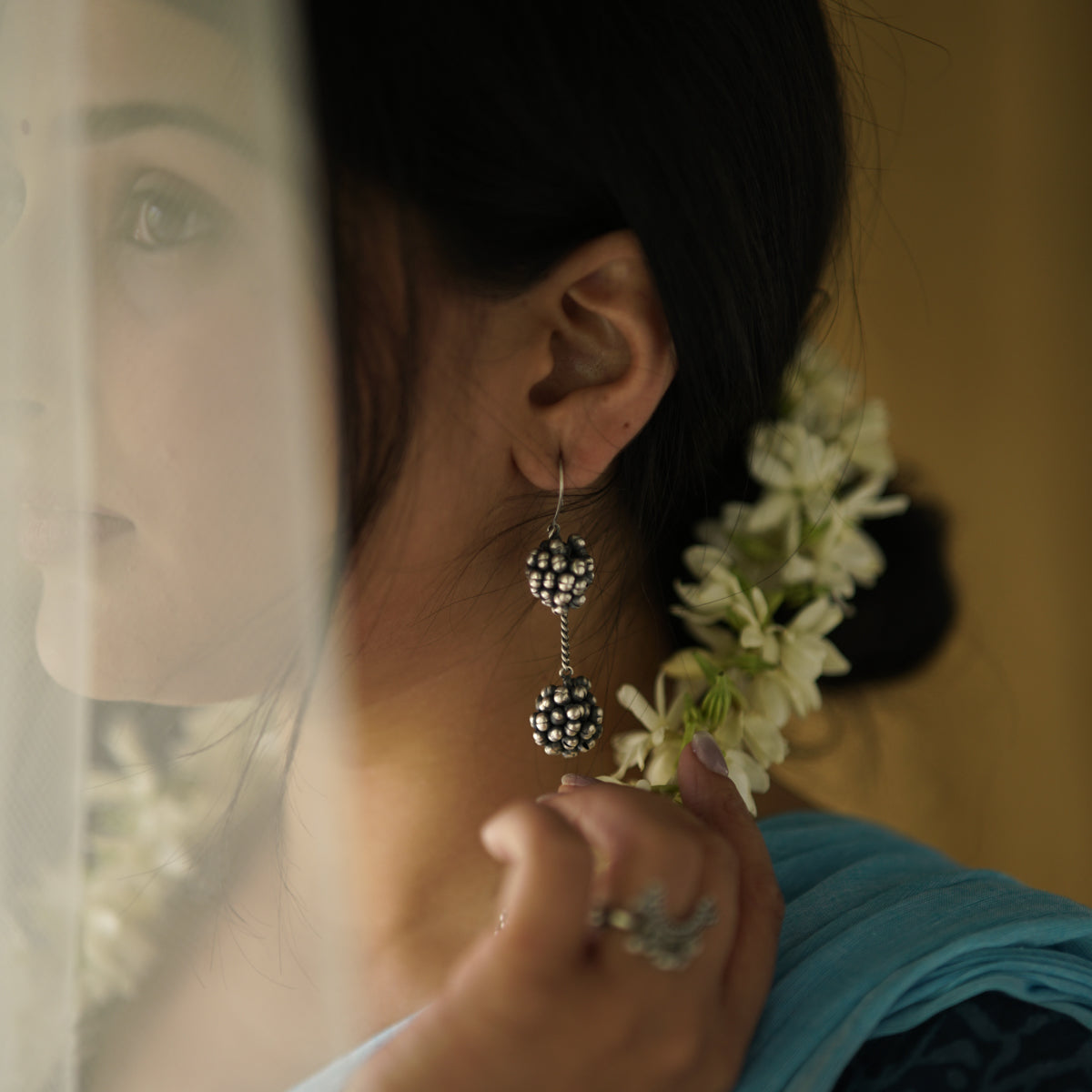 Handcrafted silver ghungroo bunch earrings close-up oxidized finish