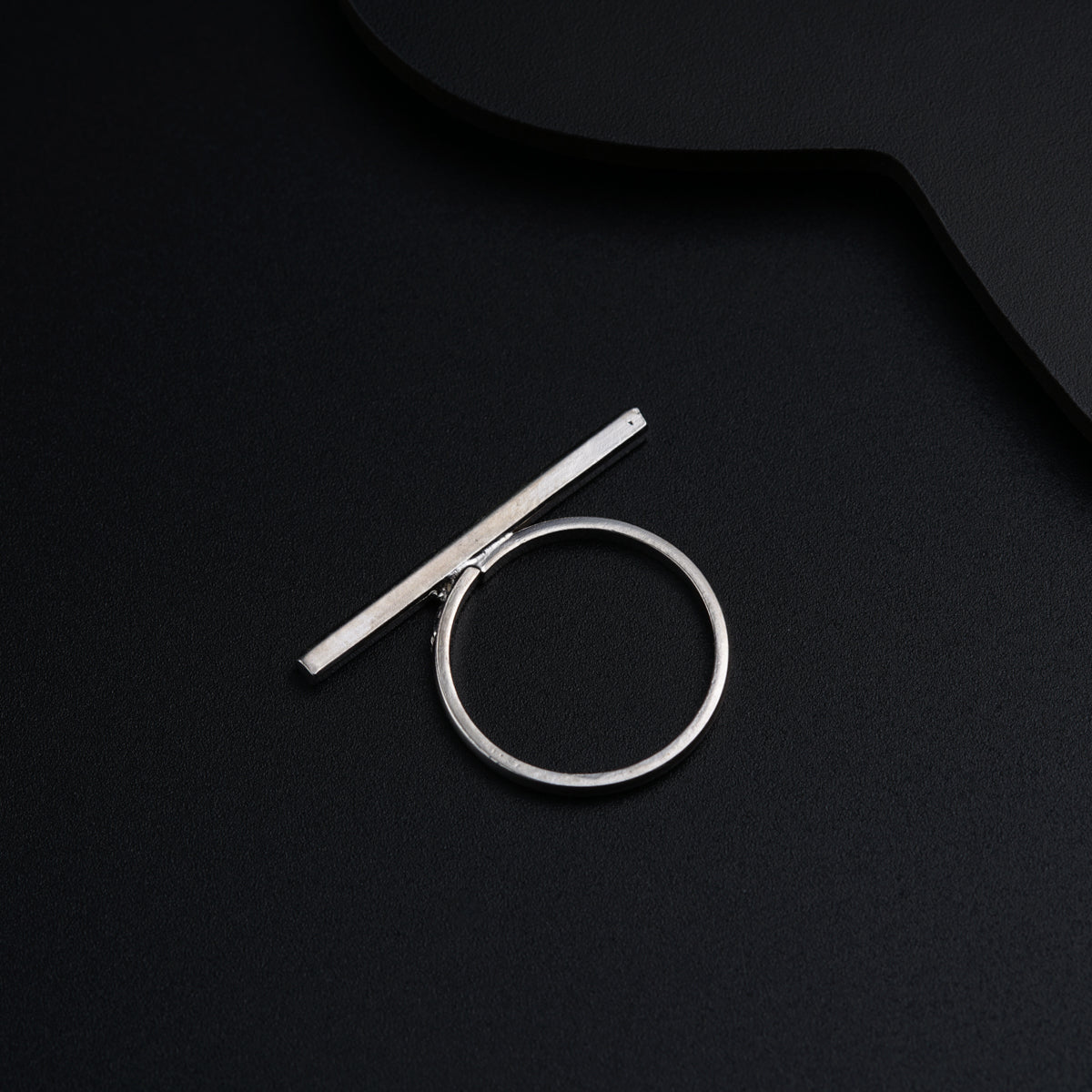 a pair of scissors sitting on top of a black surface