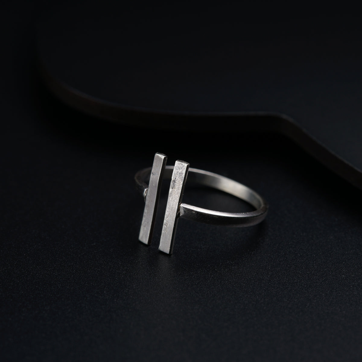 a close up of a ring on a black surface